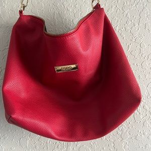 Red crossbody purse. It comes with a smaller mini bag